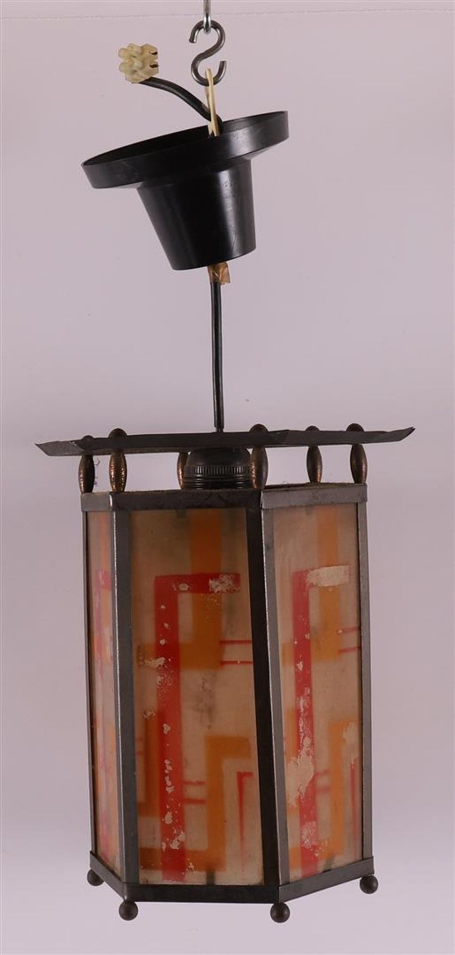 A hexagonal glass-in-copper Amsterdam school hall lamp with fringe, ca. 1920.