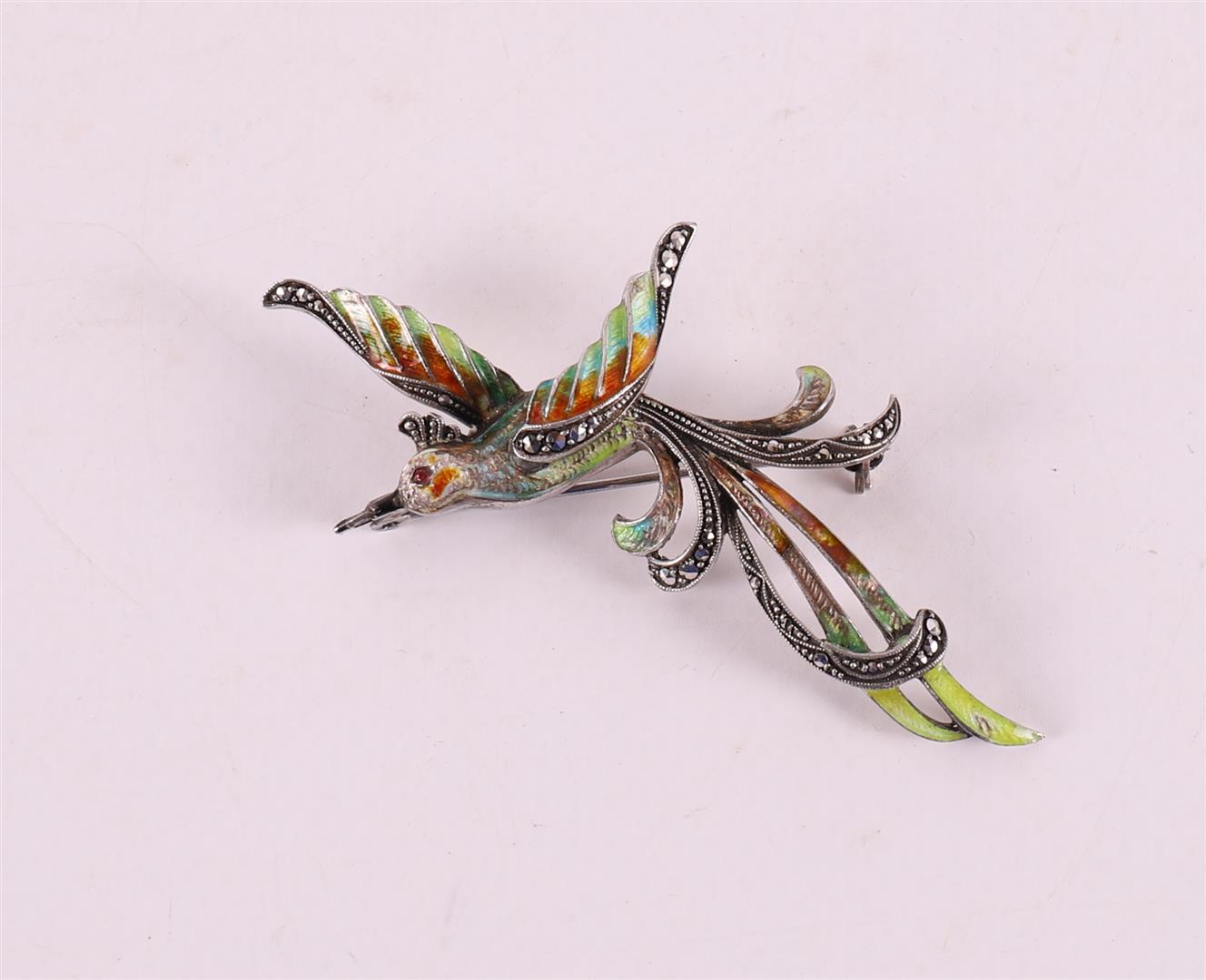 An enamelled brooch in the shape of a bird of paradise with marcasites.