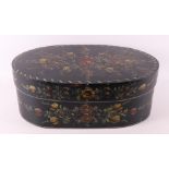 An oval chip box with polychrome floral decor, 20th century painted.