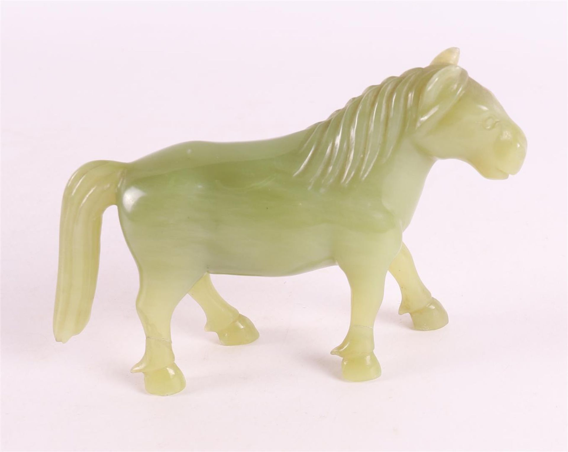 A green jade horse on a tropical wooden loose pedestal, China, around 1900. - Image 6 of 6