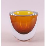 An orange glass unique vase encased in a clear glass layer, Olaf Stevens.
