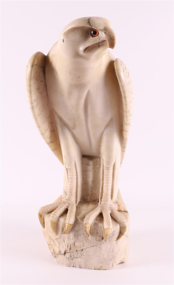 An alabaster sculpture of a bird of prey, ca. 1930.