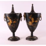 A pair of black lacquered metal chestnut vases, circa 1800.