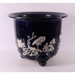 A dark blue glazed cachepot, China, 19th C. or earlier.