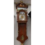 A double capped tail clock with brass spheres crowning, 19th century