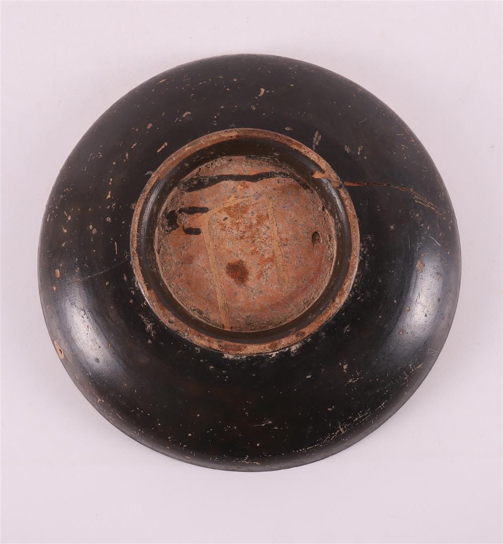 A black glazed earthenware bowl, Greece, 4th century b.c. - Image 3 of 4