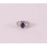 A 900/1000 platinum ring set with blue sapphire and 26 diamonds