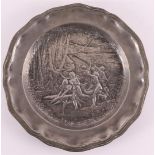 A blank pewter dish with Art Nouveau relief of forest nymphs, France, 1900.