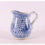 A blue/white porcelain milk jug, China, circa 1800.