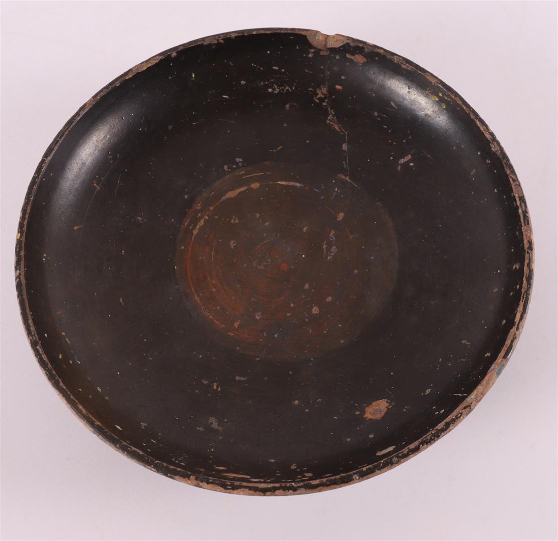 A black glazed earthenware bowl, Greece, 4th century b.c. - Image 2 of 4