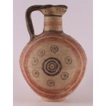 A Cypriot convex crockery pitcher with handle, ca. 600 - 475 BC.