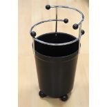 A black bakelite conical paper bin with chrome metal frame, ca. 1920.