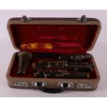 A clarinet in original case, Hsinghai, made in China.