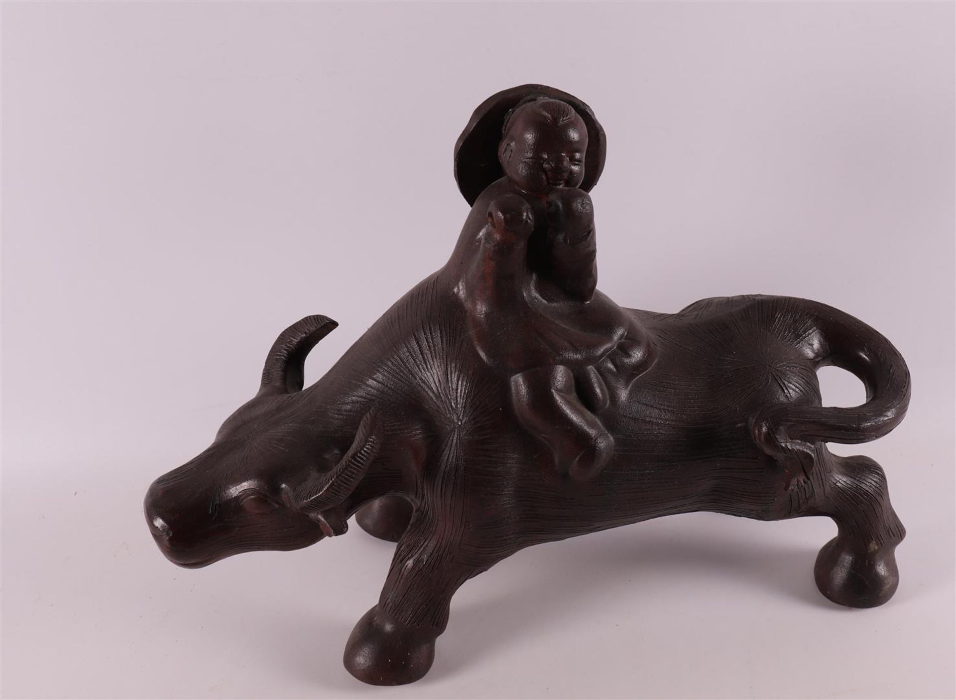 A stoneware water buffalo with a fool on its back, China, 21st century. - Bild 2 aus 4