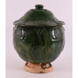 A green glazed earthenware offering jar with lid, China, Song/Yuan dynasty