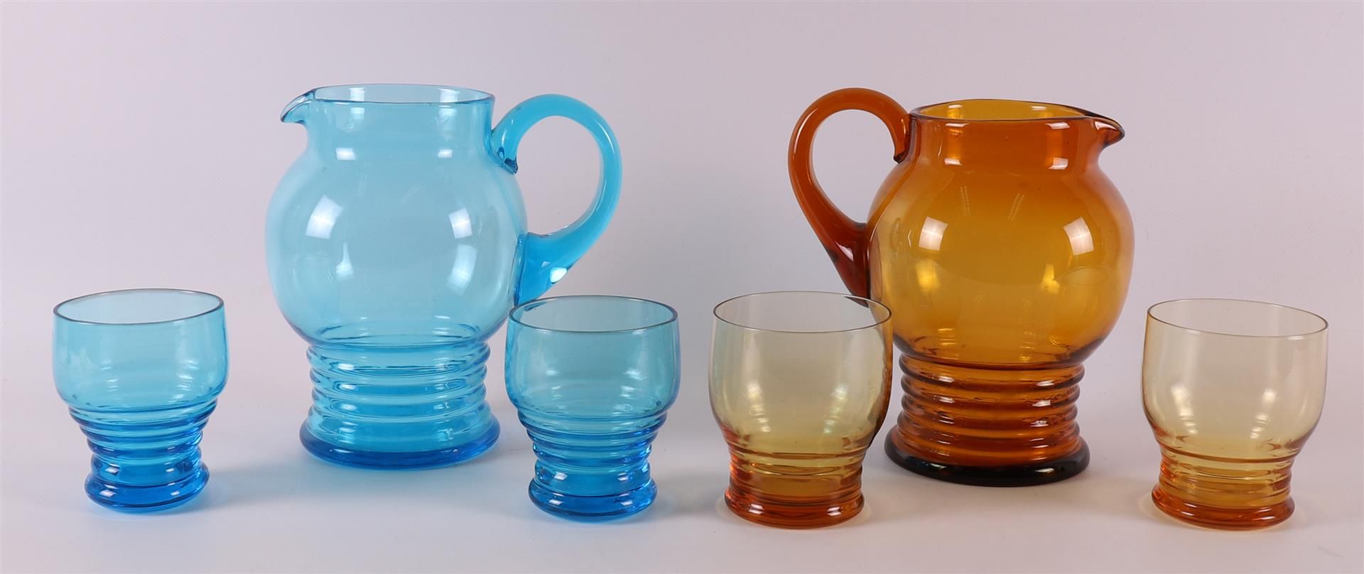 Netherlands, Maastricht. A blue and brown glass water carafe with glasses, ca. 1