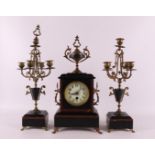 A three-part black/red marble mantel clock set, France, 2nd half of the 19th cen