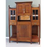 A walnut salon cabinet, new art, around 1900.