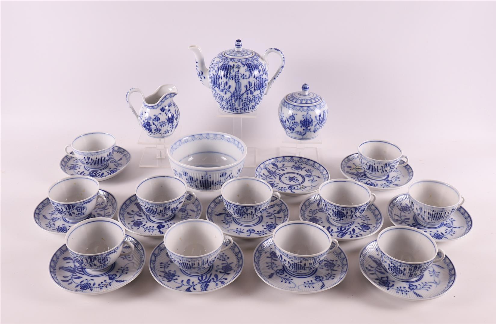 A white porcelain tea service fragment with blue Saxon decor, circa 1900