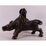 A stoneware water buffalo with a fool on its back, China, 21st century.