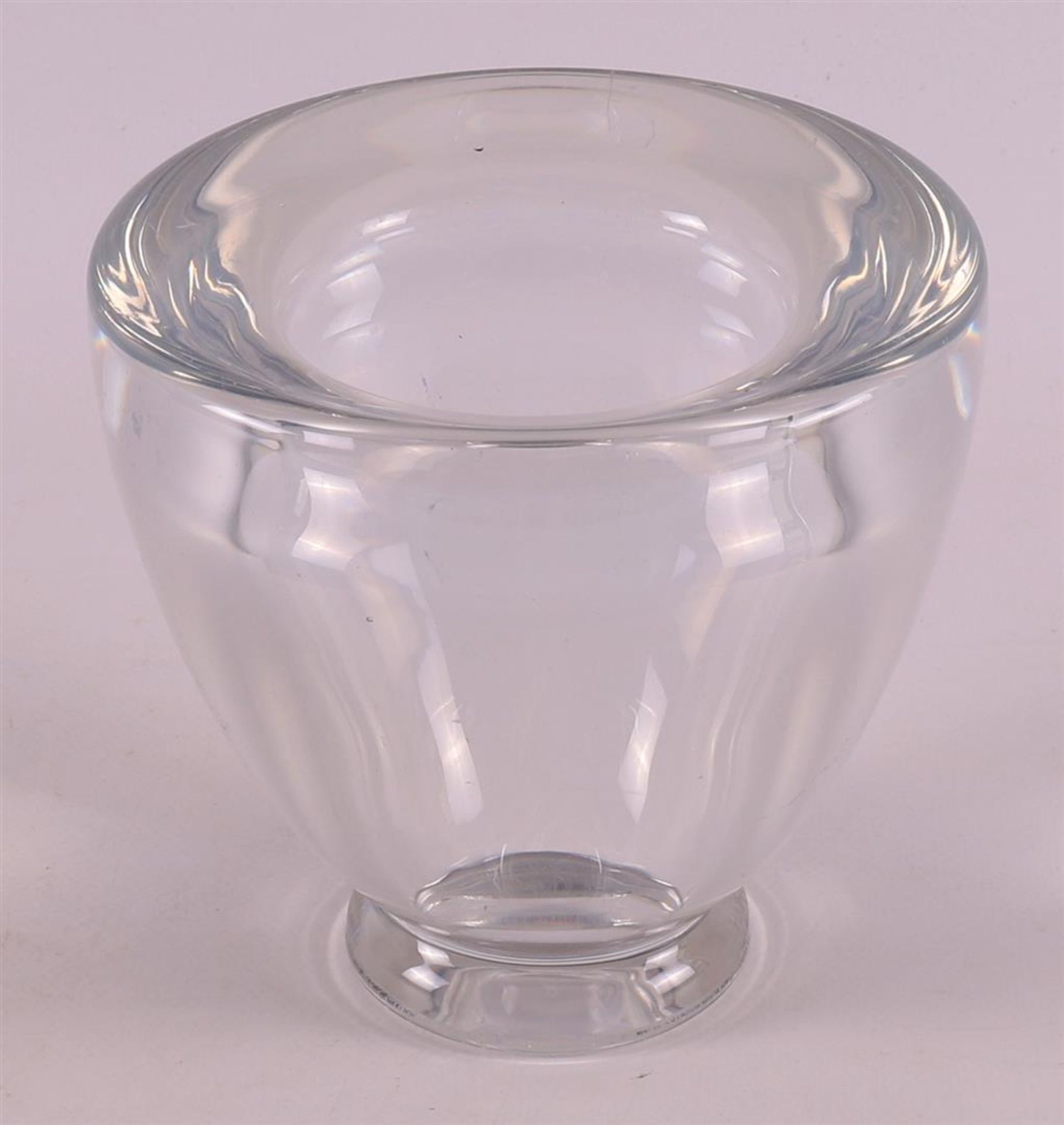 A thick-walled clear glass Art Deco vase, presumably Leerdam, ca. 1930.