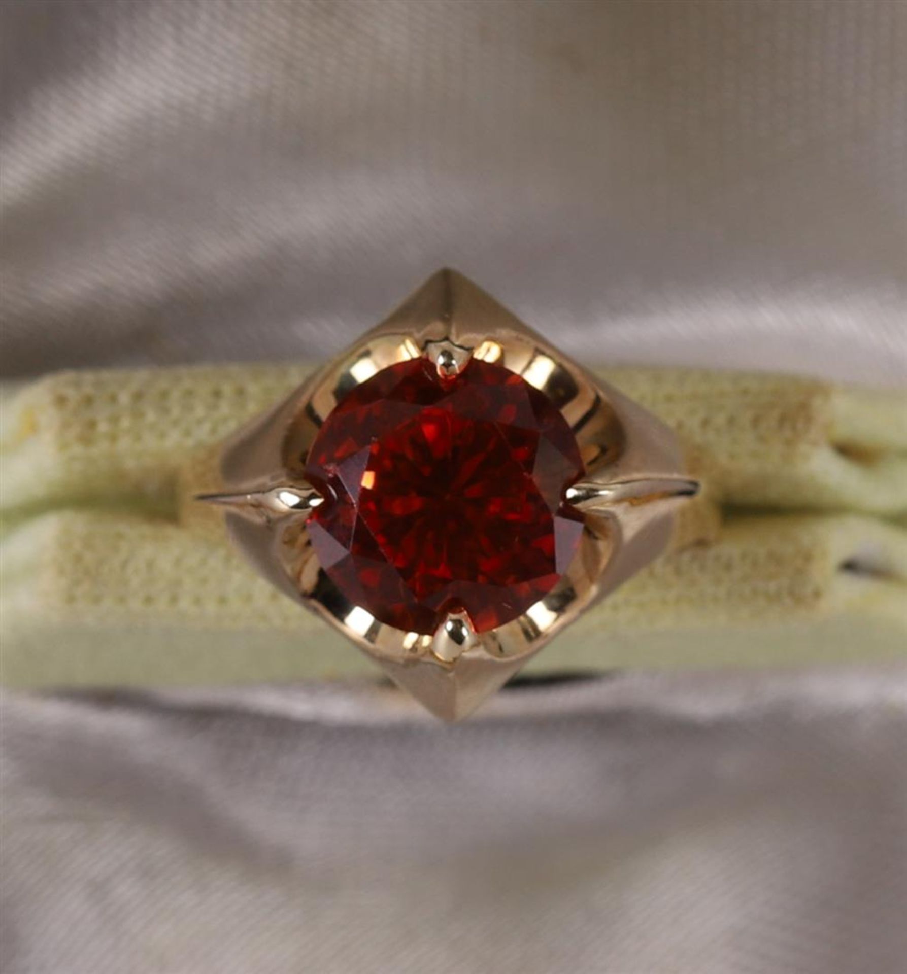 A 14 kt 585 yellow gold ring, set with diamond-cut red sapphire. - Image 2 of 3