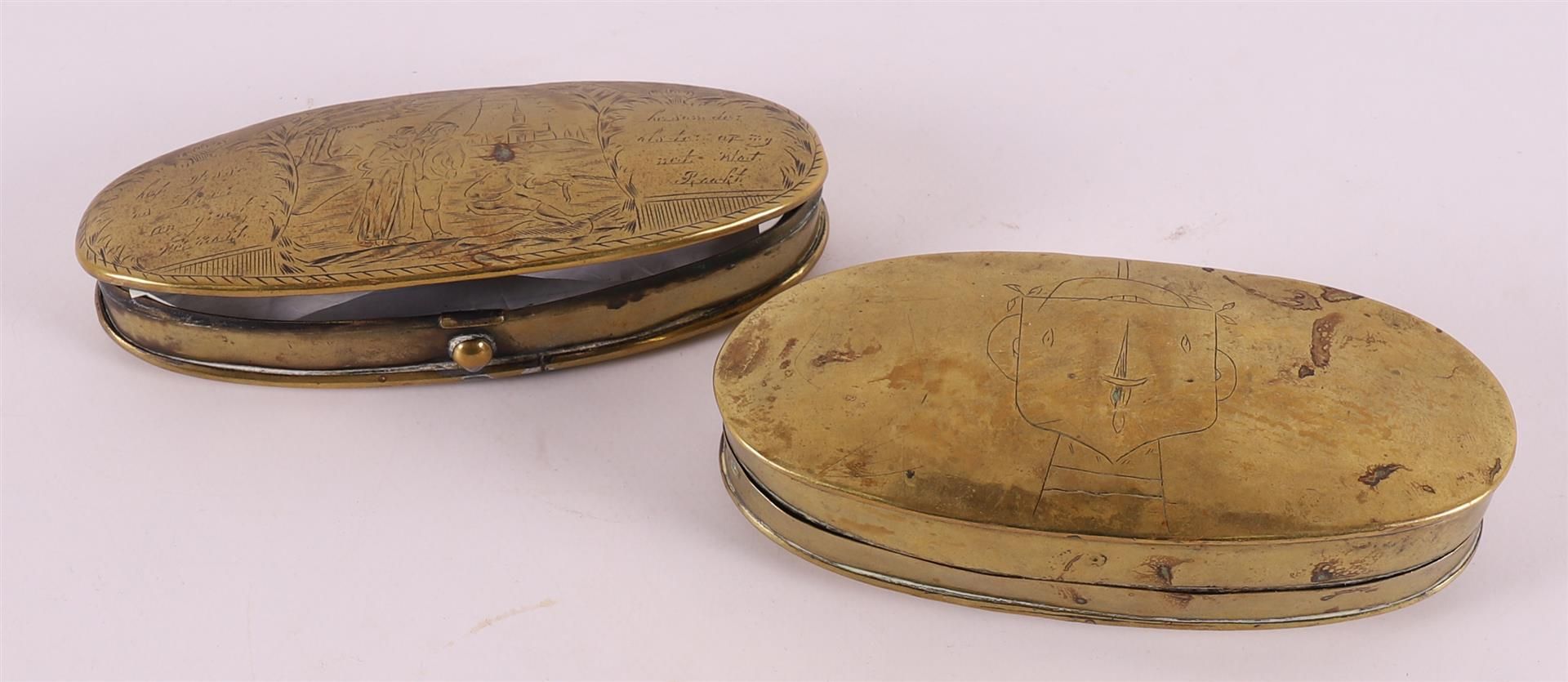 Two various brass tobacco boxes including text.