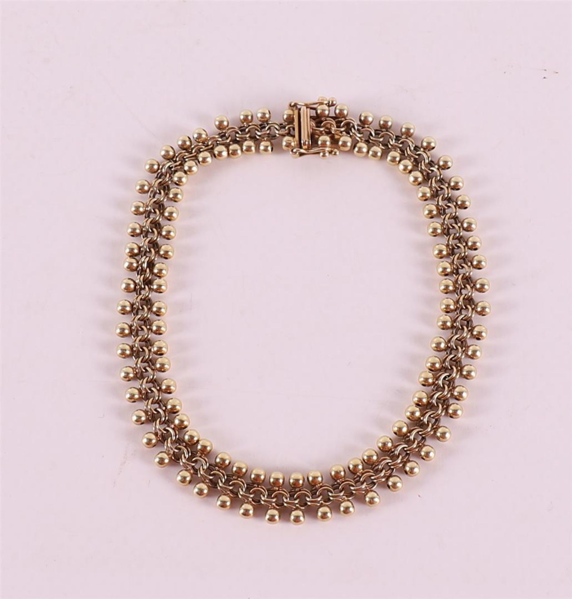 A 14 kt 585/1000 gold ball bracelet, 19th century.