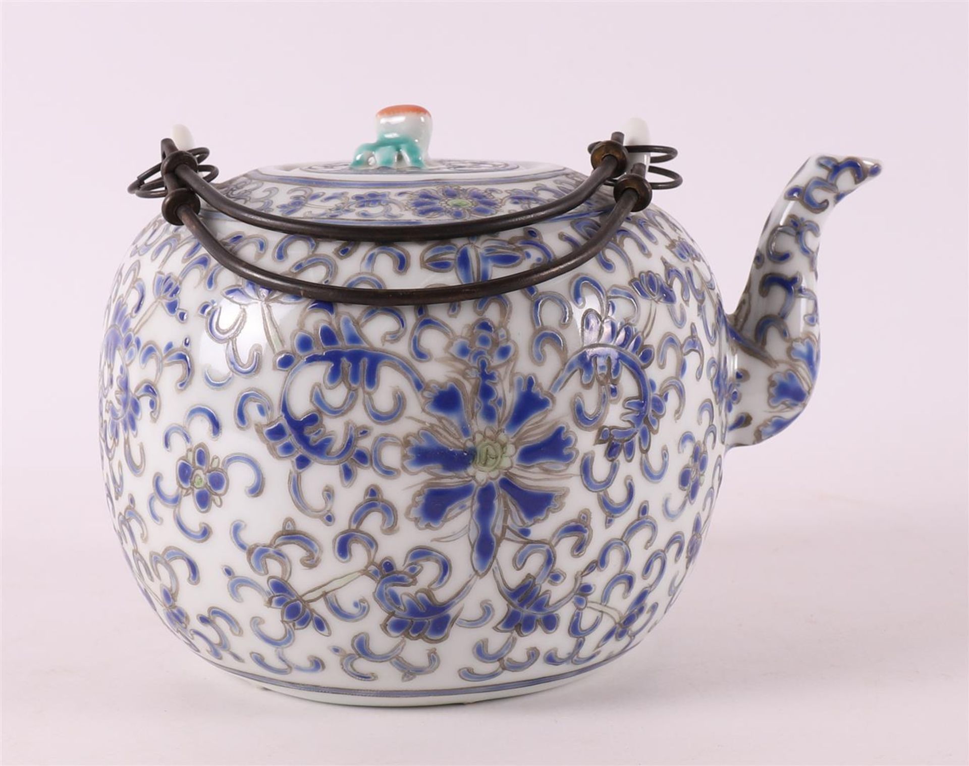 A porcelain teapot, China, circa 1900.