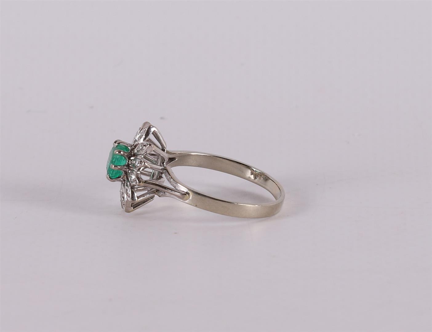 An 18 carat gold ring with an emerald cut emerald and diamonds. - Image 2 of 2