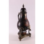 A pear-shaped black lacquered pewter tap jug, second half 19th century.