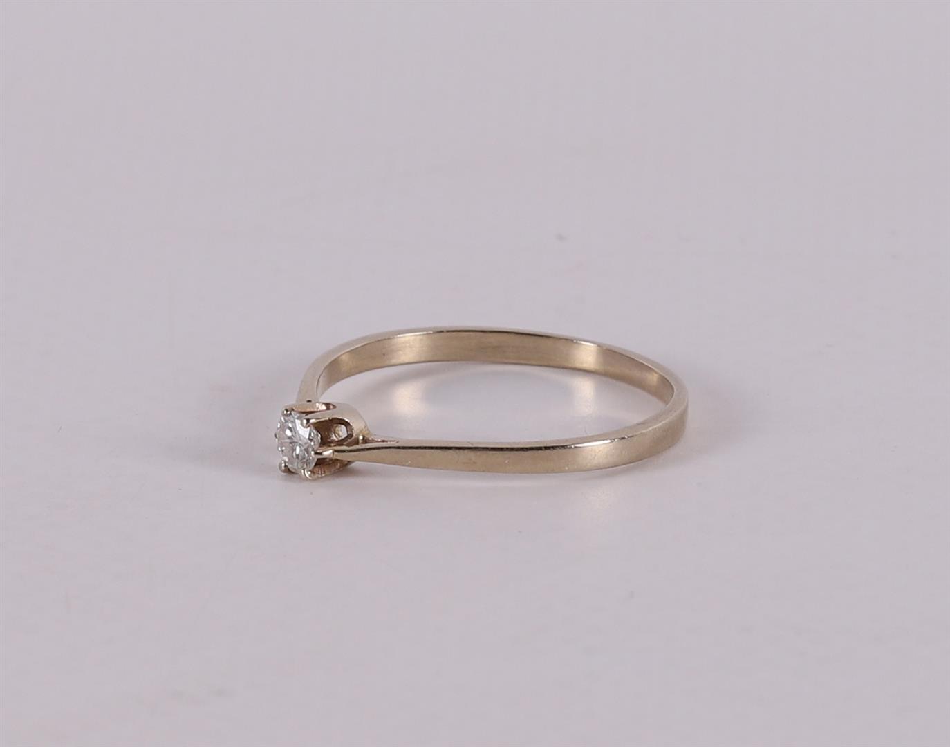 A 14 carat gold solitaire ring with a brilliant. - Image 2 of 2