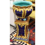 A majolica pottery cachepot on matching pedestal, 19th century.