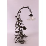 A wrought iron table lamp with glass shade, France, ca. 1930.