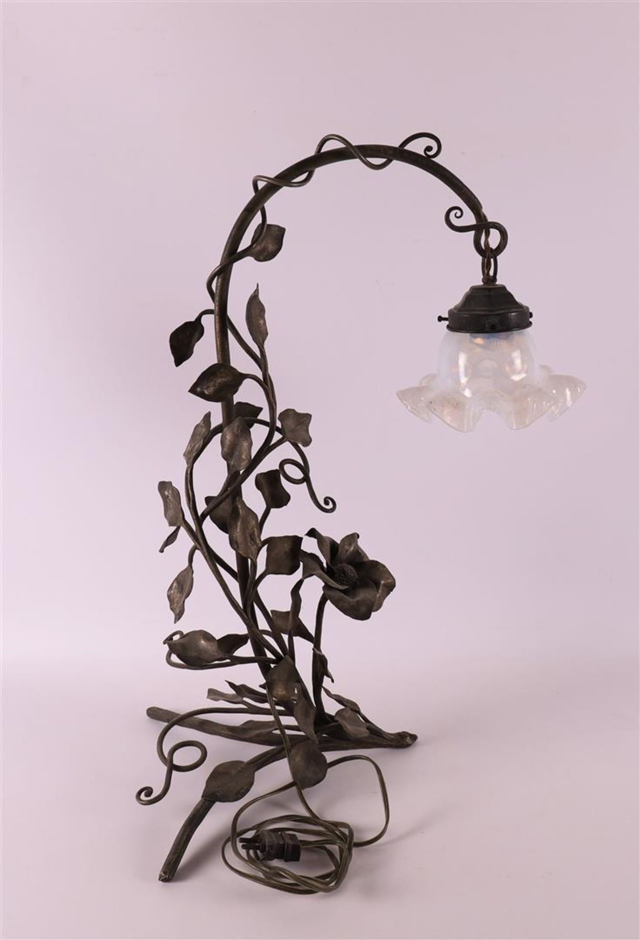 A wrought iron table lamp with glass shade, France, ca. 1930.