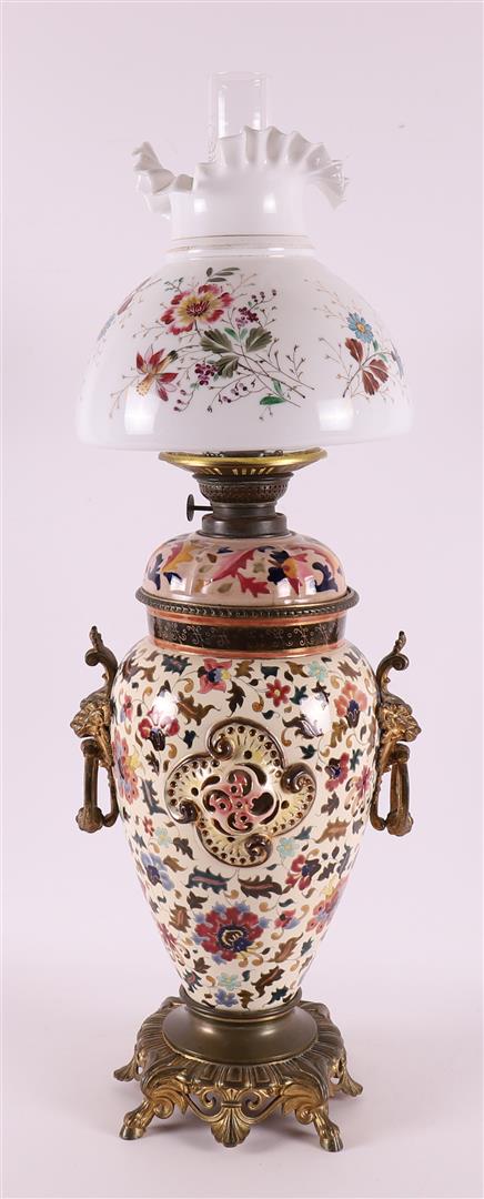 A white metal and earthenware table lamp with frosted glass shade, late 19th cen