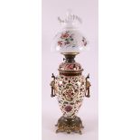 A white metal and earthenware table lamp with frosted glass shade, late 19th cen
