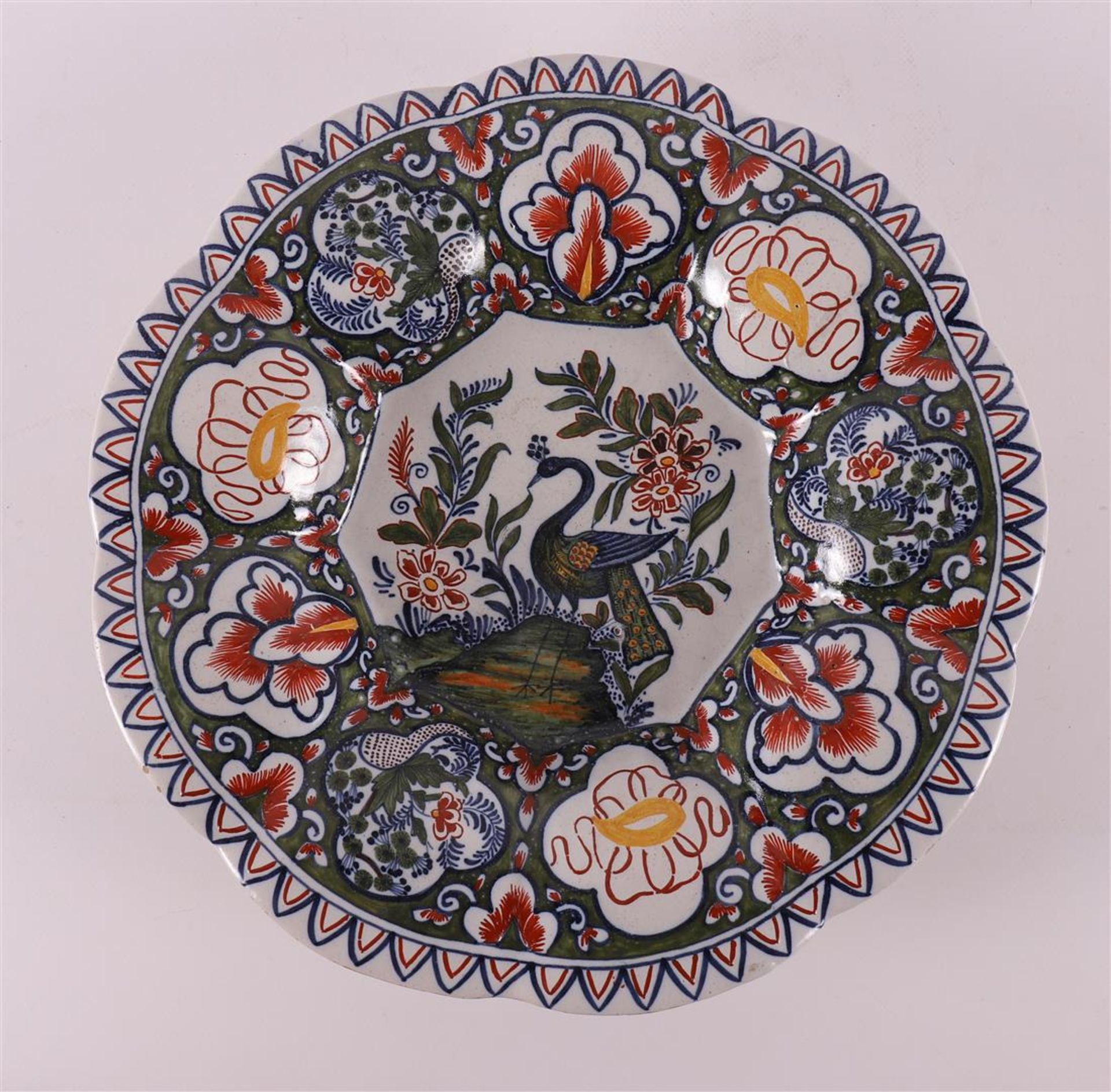 An earthenware folding dish, after a Delft example, 20th century.