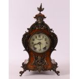 A mantel clock, Louis XV style, late 19th century.