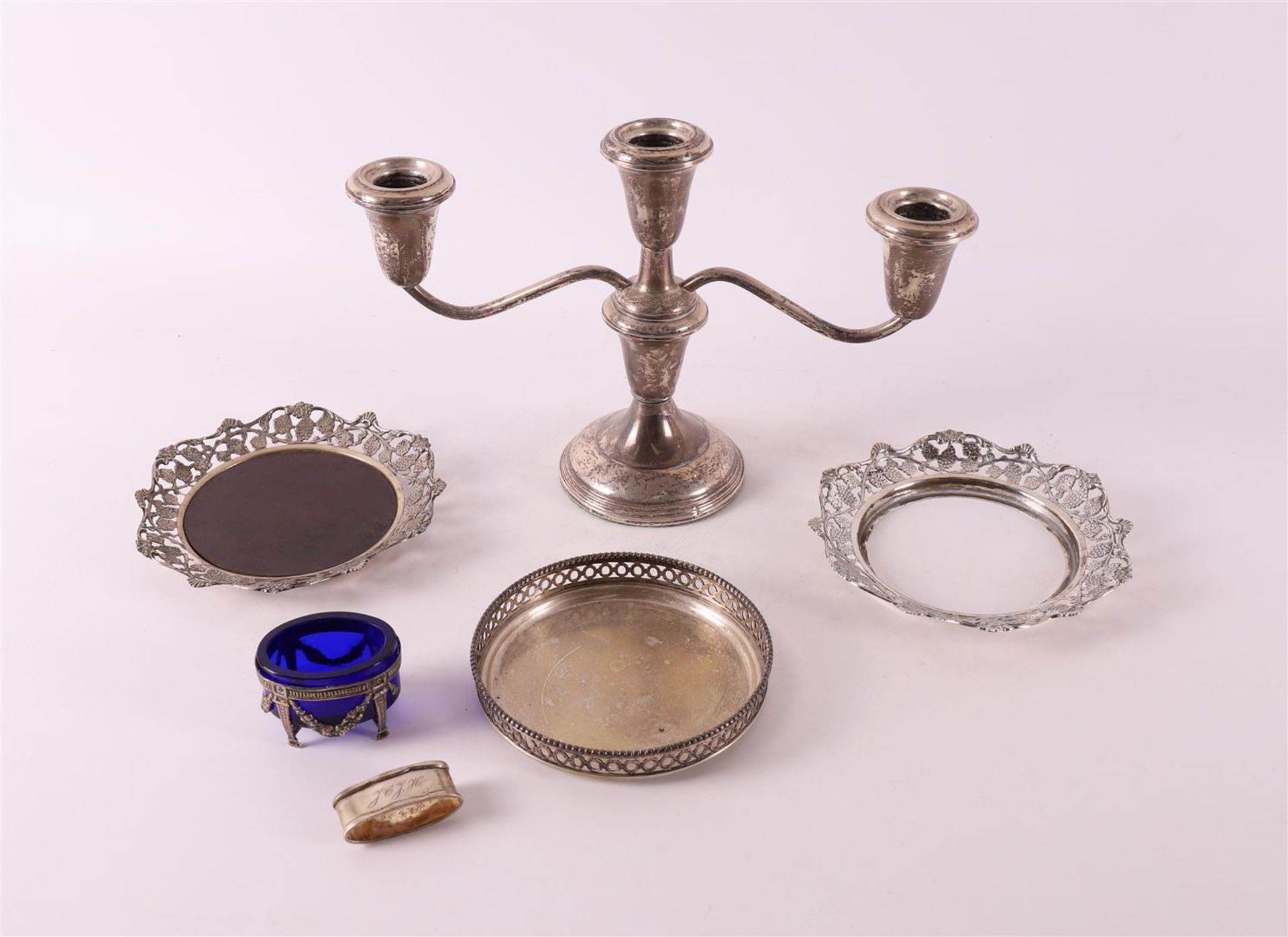A lot of various silver, including plaster-filled candlestick, salt shaker and c