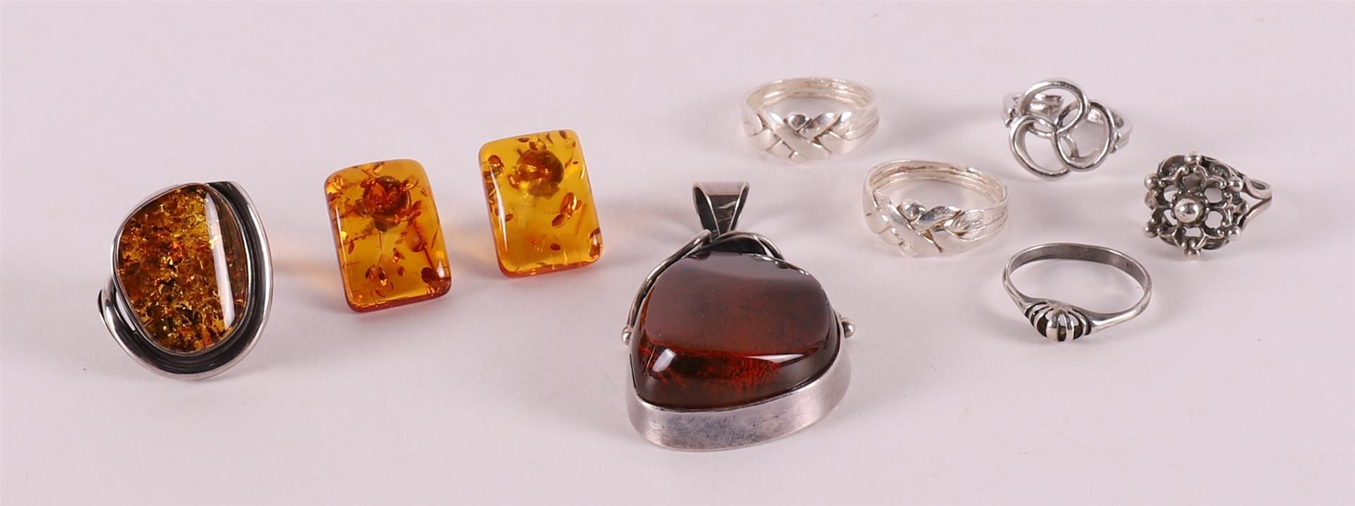 A lot of various vintage silver jewellery, including rings and pendant.