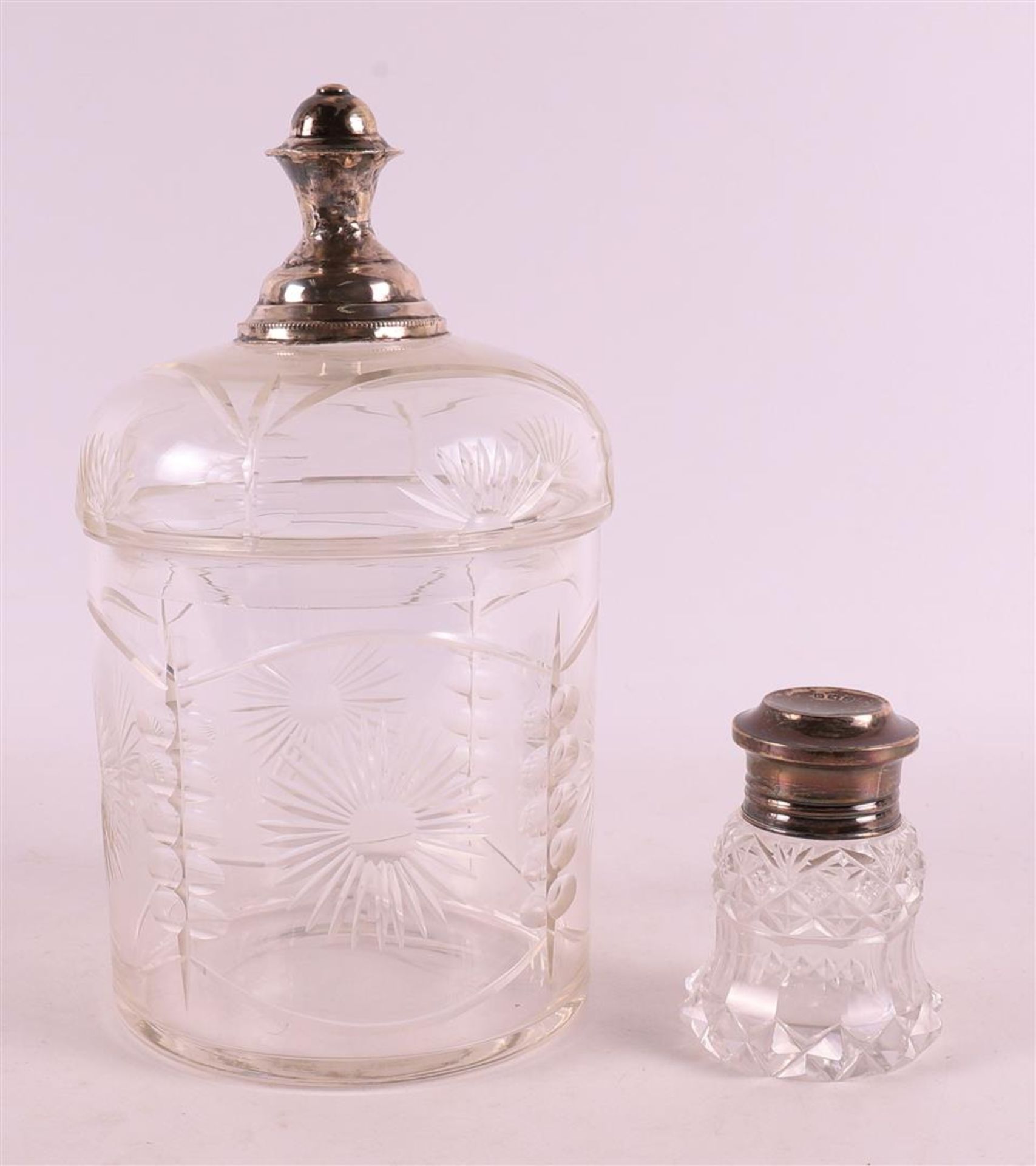 A clear crystal rusk tin with silver knob crown, early 20th century.