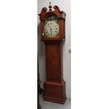A longcase clock in walnut stained softwood case, England 19th century.