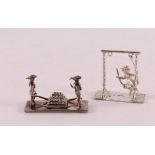 Etagere silver. A second grade silver cheese carrier + girl on a swing.