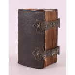 A bible in brown leather binding with double silver clasp, 18th century