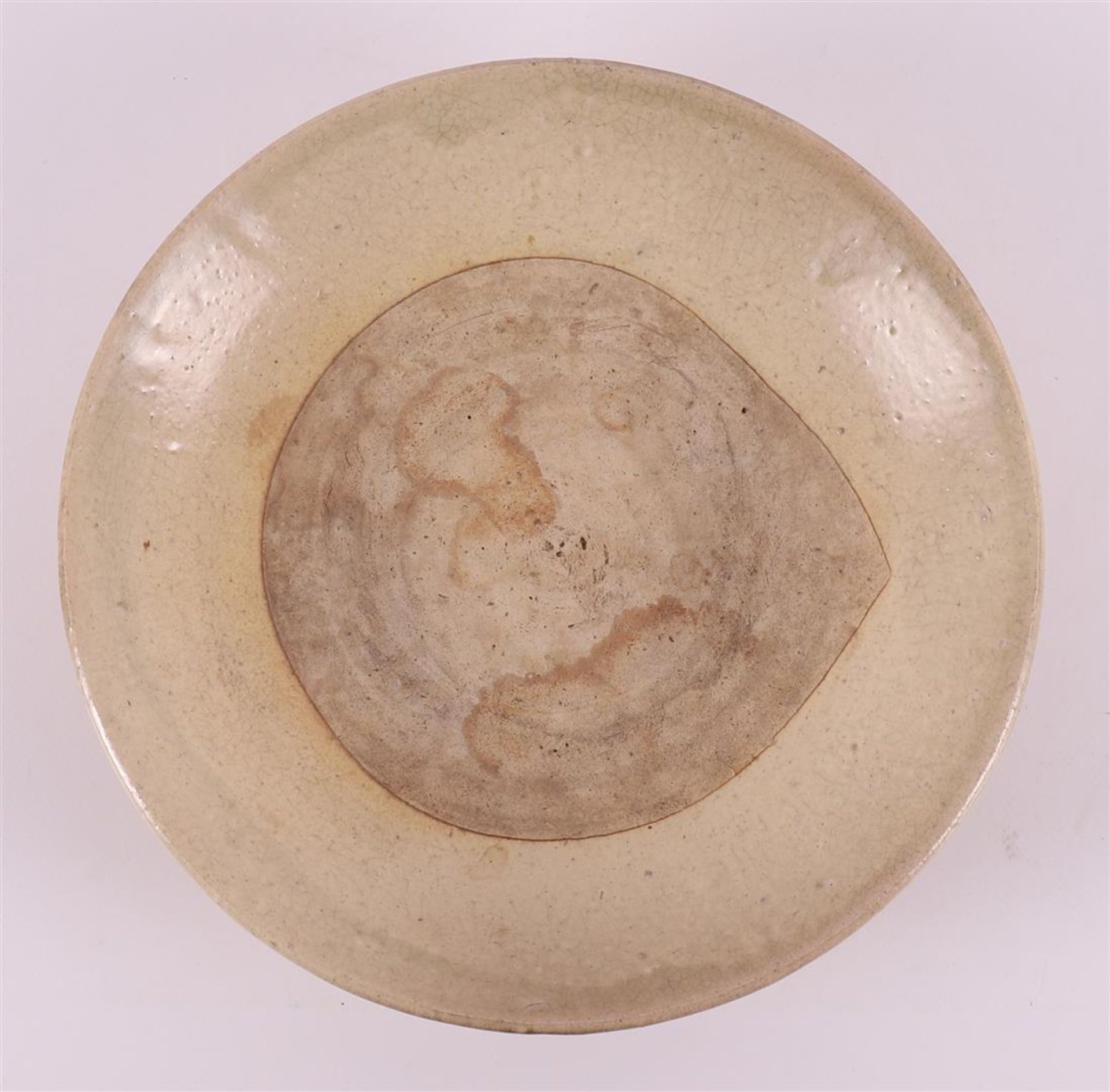 A cream stoneware dish, China/Annam Vietnam, Ming, 15th century.