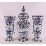 An earthenware three piece garniture, Louis XV style, late 19th century