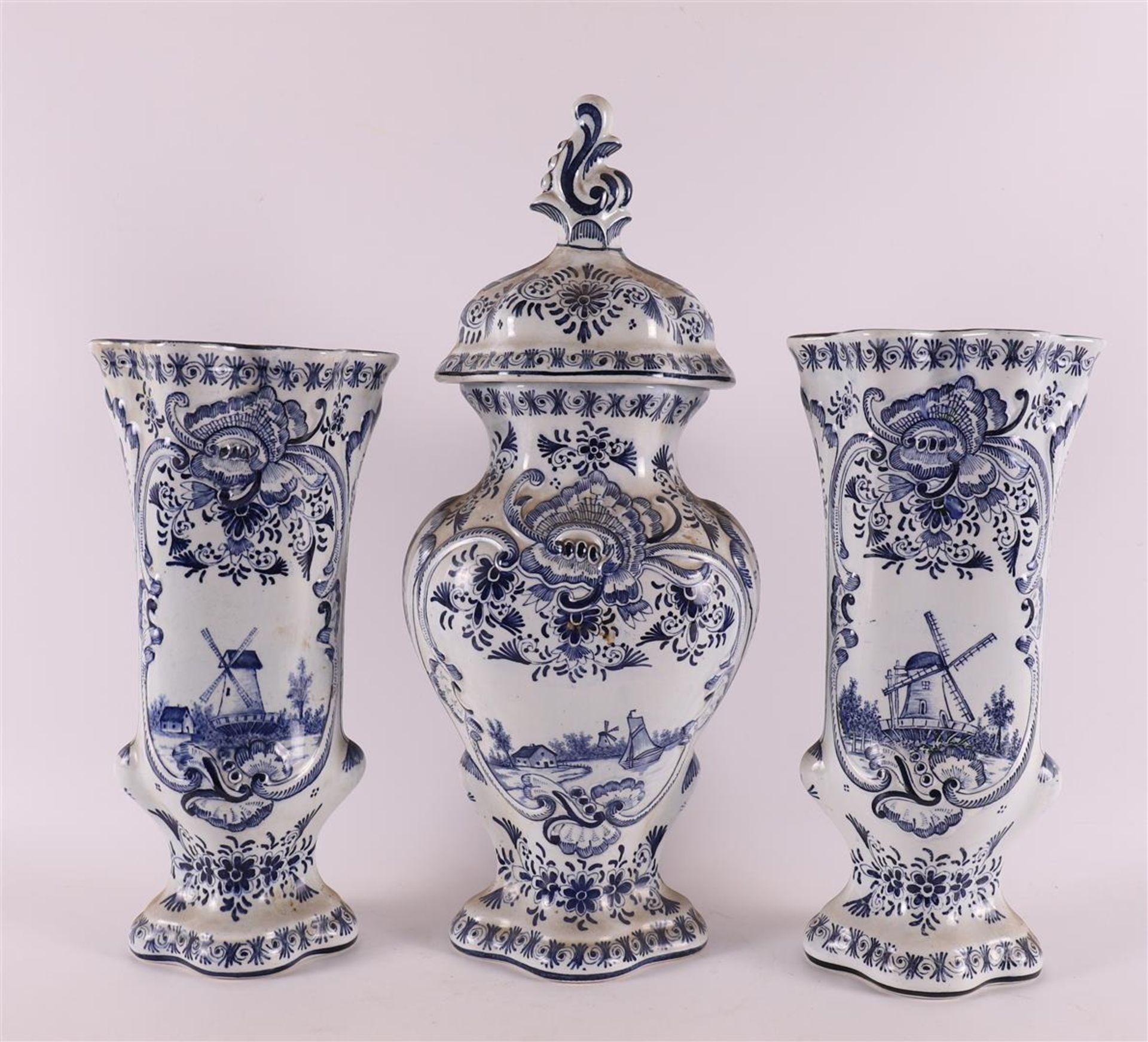 An earthenware three piece garniture, Louis XV style, late 19th century