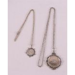 Two various silver coin pendants on a necklace, 10 guilders 1973 and 1/2 guilder