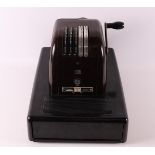 A brown Bekelite cash register, Secura, Germany, ca. 1930.